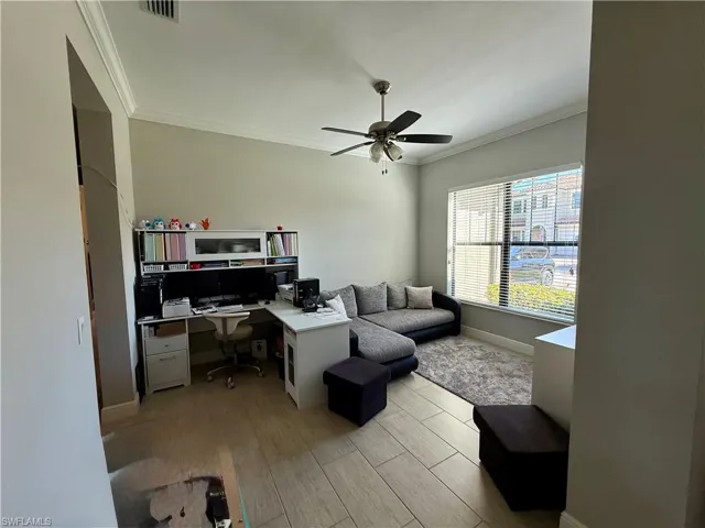 Office featuring wood tiled floors, ornamental molding, and a ceiling fan