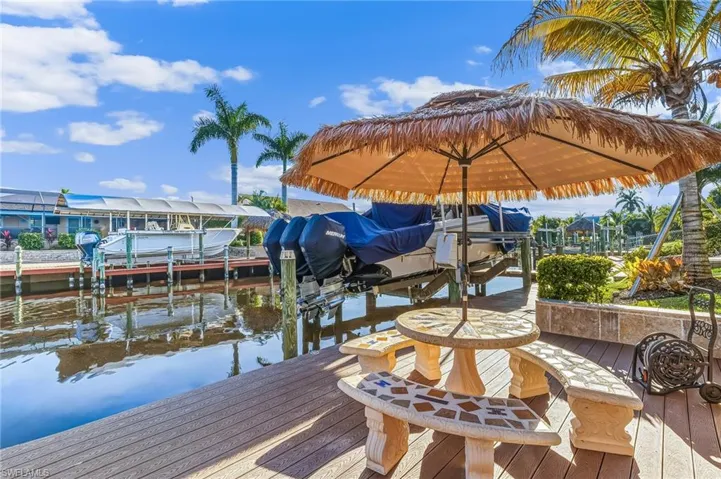 Dock with boat lift and a water view