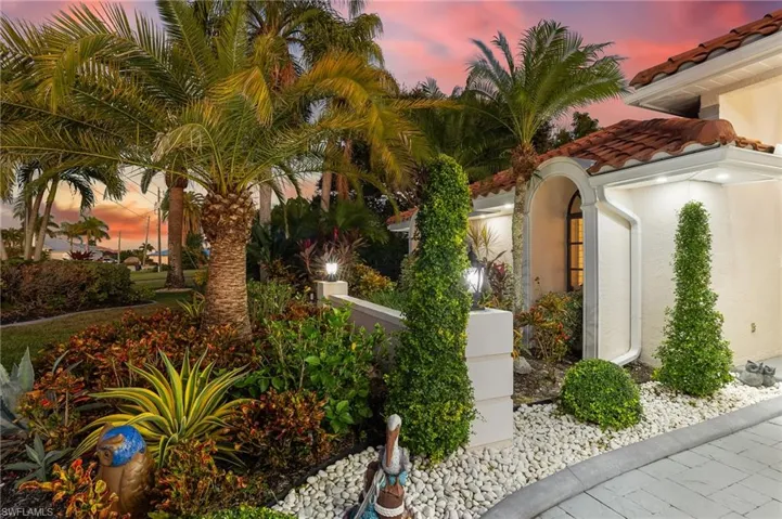 Property exterior at dusk featuring stucco siding