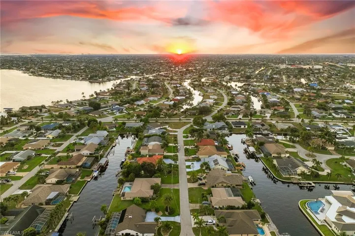Aerial perspective of suburban area with a large body of water