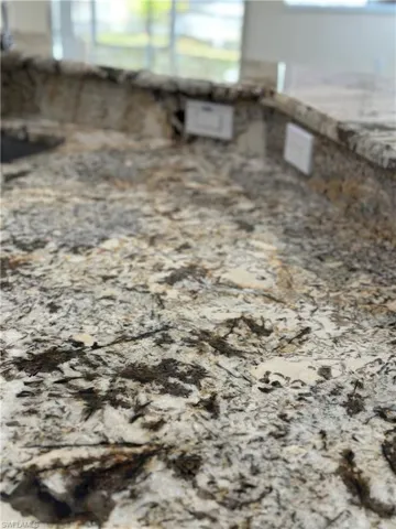 Kitchen view of light stone counters
