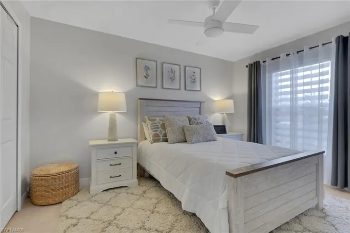 Bedroom with a ceiling fan and a closet