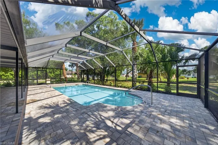 Screened outdoor pool with paver patio