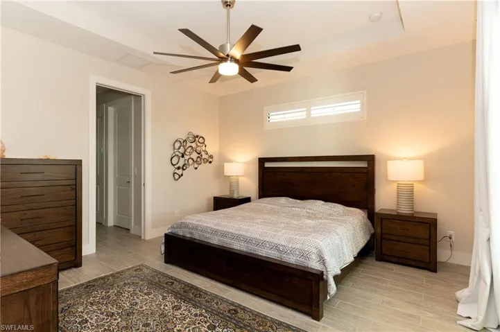 Bedroom featuring light wood-type flooring and ceiling fan