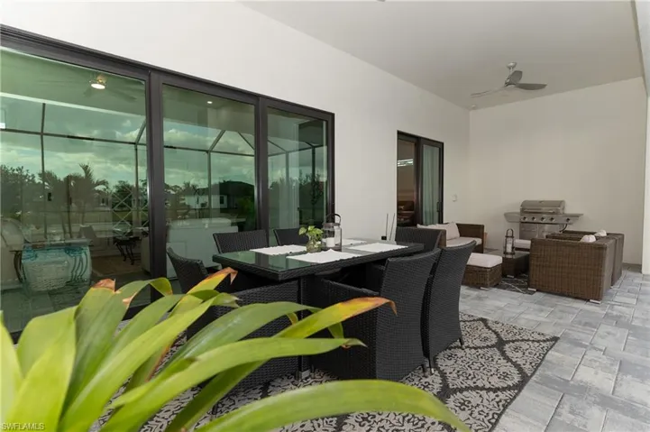 View of patio / terrace featuring outdoor lounge area, ceiling fan, and a grill