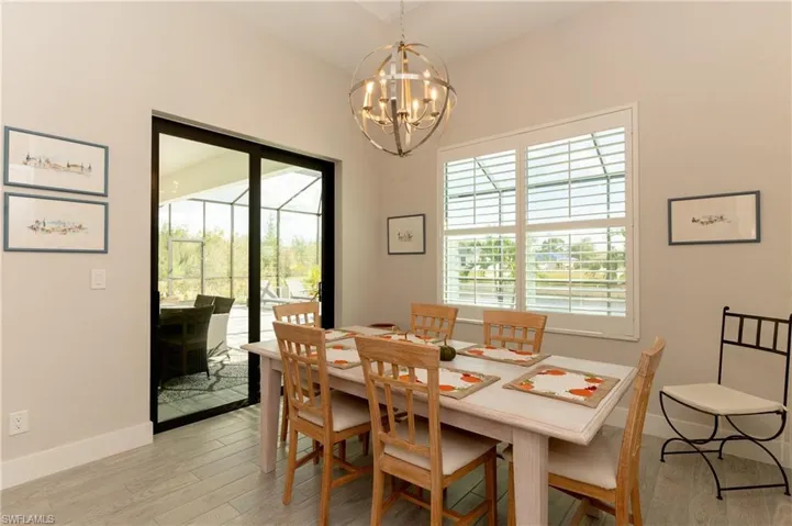 Dining room featuring light hardwood / wood-style floors and a chandelier