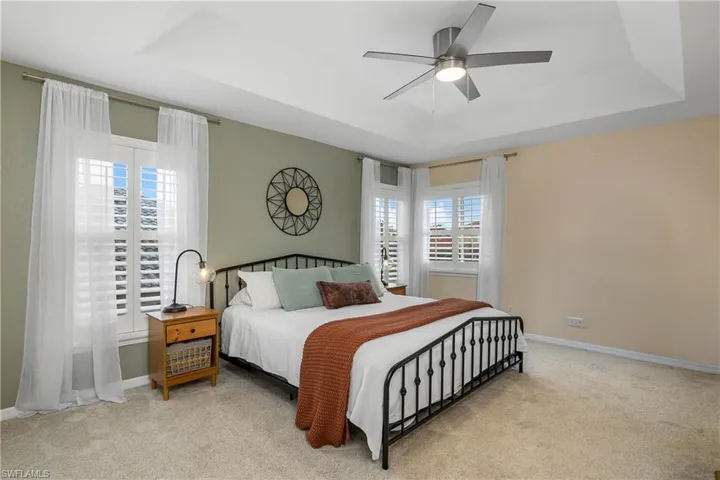 Bedroom featuring a tray ceiling