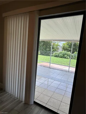 View of pool with a patio and a lawn