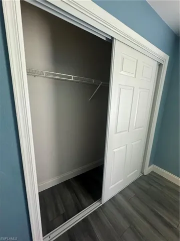 Laundry area featuring hardwood / wood-style floors and washer hookup