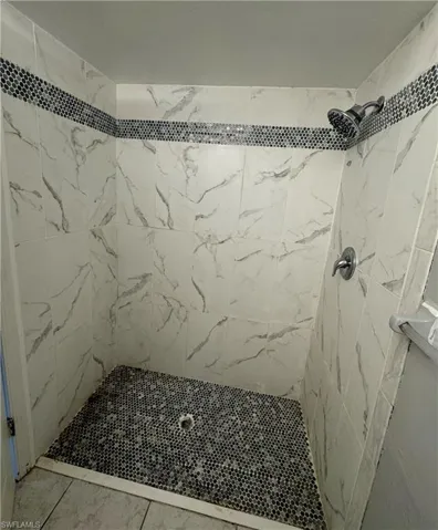 Bathroom with tile patterned flooring, toilet, and vanity