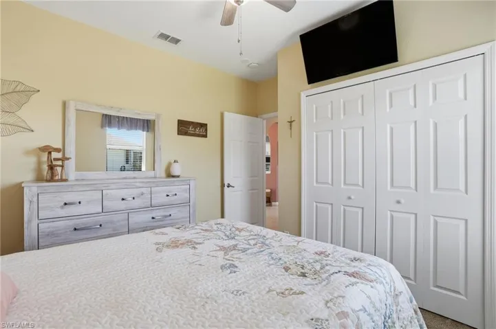 Bedroom with a ceiling fan, a closet, and carpet floors