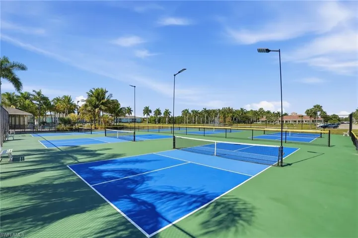 View of tennis court with community basketball court