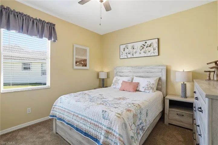 Bedroom featuring carpet floors and a ceiling fan