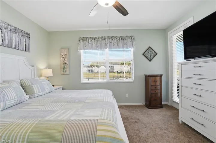 Bedroom featuring carpet flooring and a ceiling fan