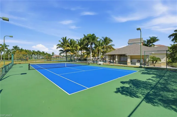 View of tennis court with community basketball court