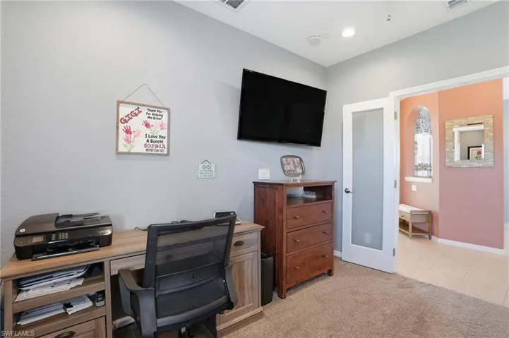 Office featuring french doors, light colored carpet, and light tile patterned flooring