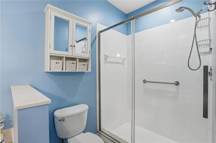 Full bath featuring a stall shower