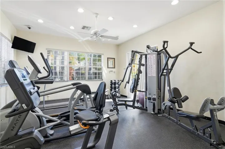 Exercise room with recessed lighting and ceiling fan