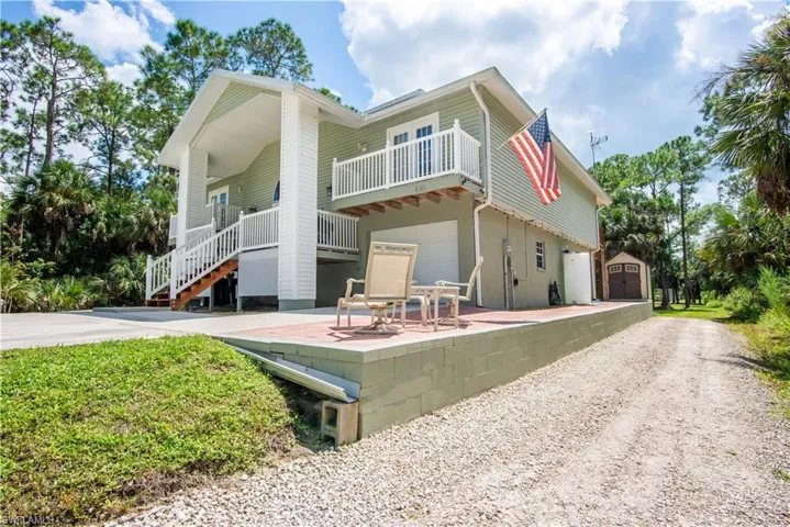 Back of house with a patio