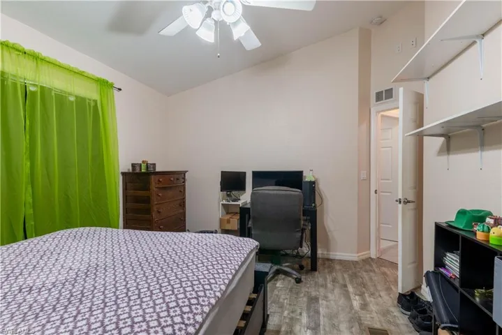 Bedroom featuring light hardwood / wood-style floors and ceiling fan