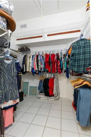 Spacious closet with tile patterned floors