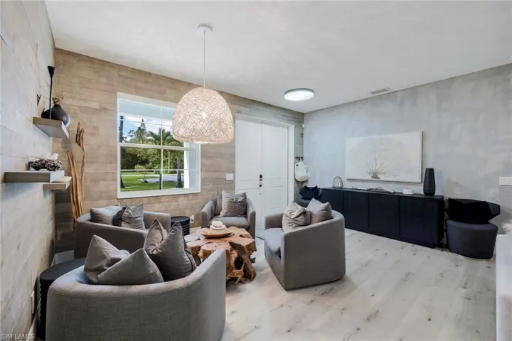 Living room with light hardwood / wood-style flooring