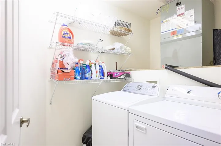Laundry area with washer and clothes dryer