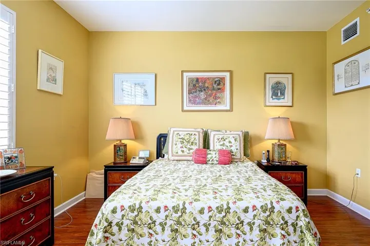 Bedroom featuring dark hardwood / wood-style floors
