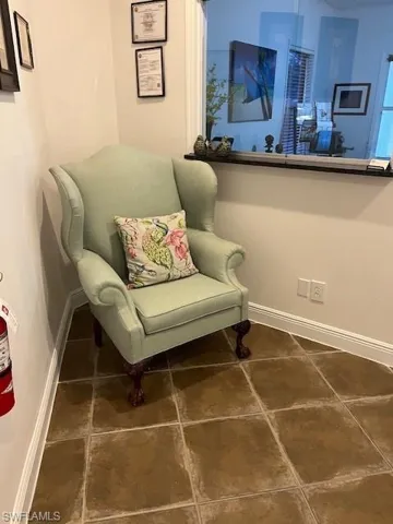 Living area with dark tile patterned floors
