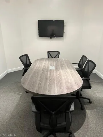 Carpeted office with baseboards