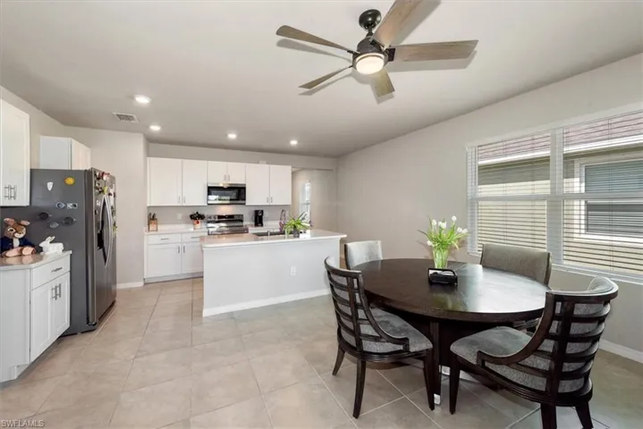 Dining space featuring visible vents, baseboards, ceiling fan, recessed lighting, and light tile patterned flooring