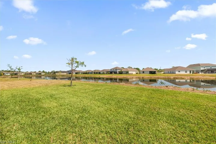 View of yard with a water view and a residential view