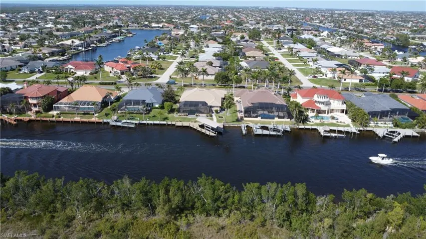 Drone / aerial view featuring a residential view and a water view