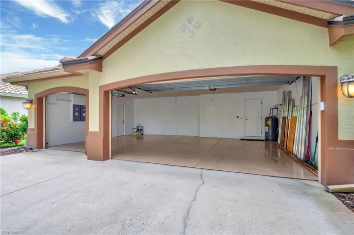 Garage featuring electric water heater
