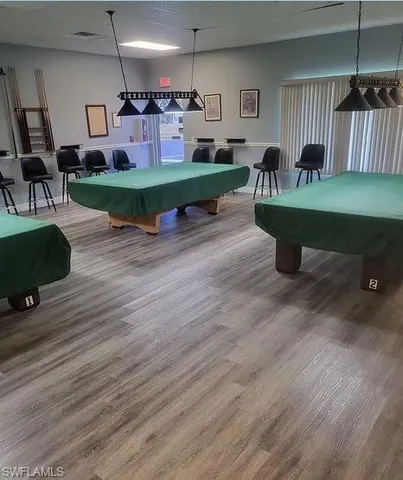 Rec room with billiards and wood finished floors