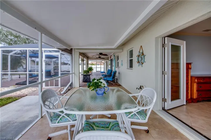 Sunroom featuring ceiling fan