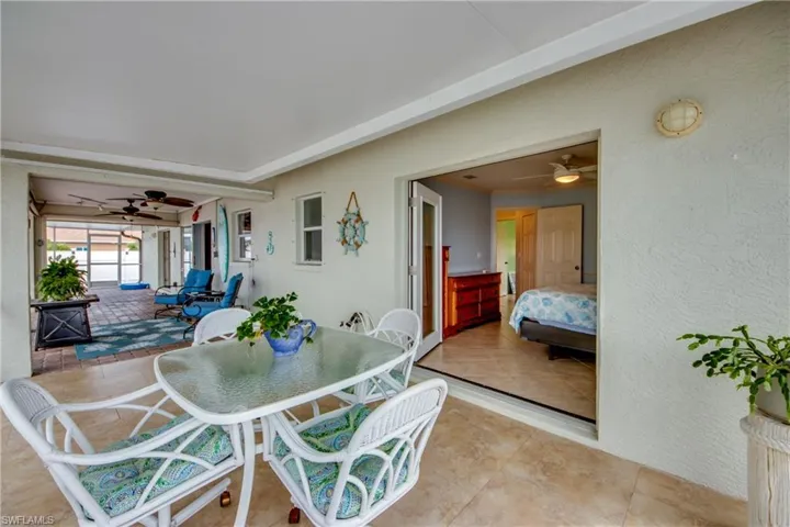 Dining area with ceiling fan and tile patterned floors