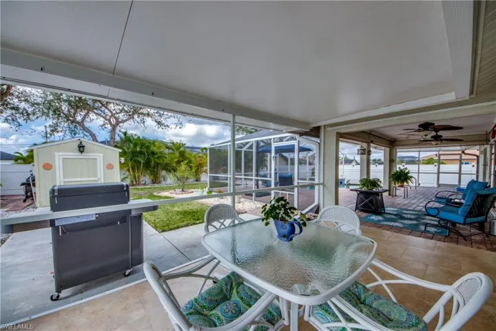 Sunroom featuring ceiling fan