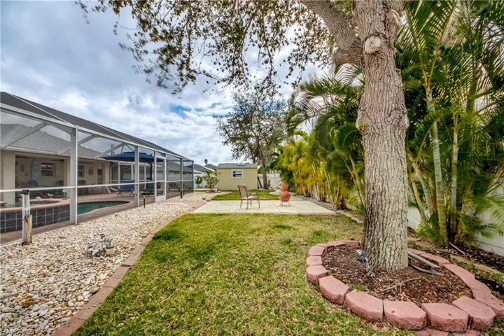 View of yard featuring a lanai and a patio