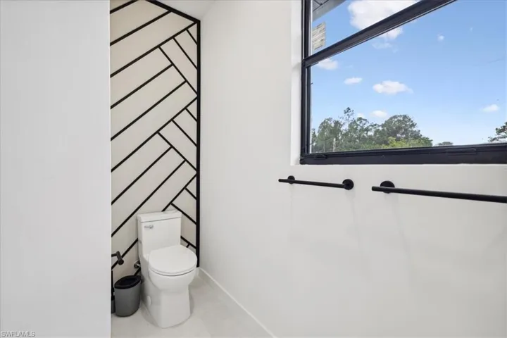 Bathroom featuring toilet and tile patterned floors