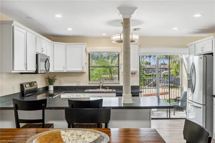 See the pool area and canal from the breakfast bar