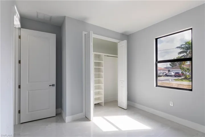 Unfurnished bedroom with a closet