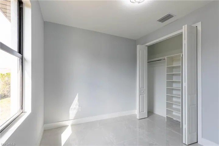 Unfurnished bedroom featuring a closet