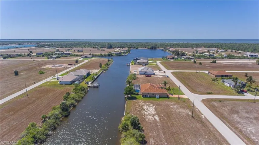 Aerial view of residential area with a large body of water
