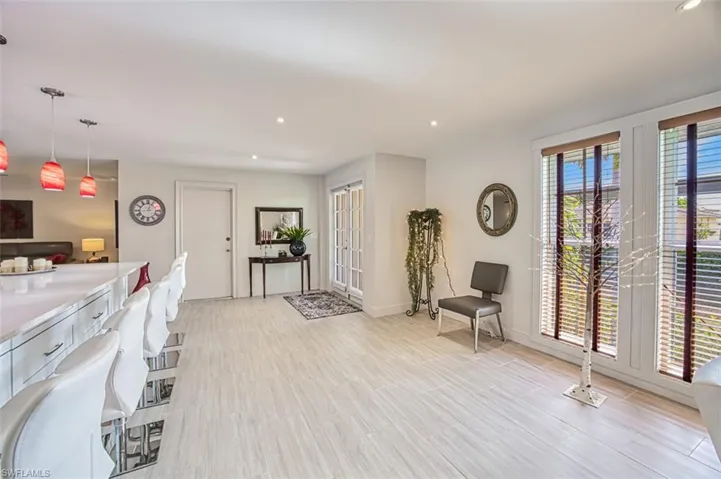 Living area with light hardwood / wood-style flooring