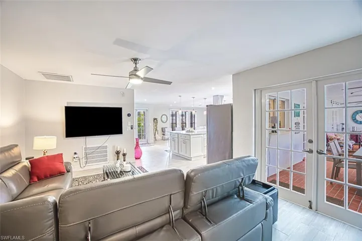 Living room with french doors and ceiling fan