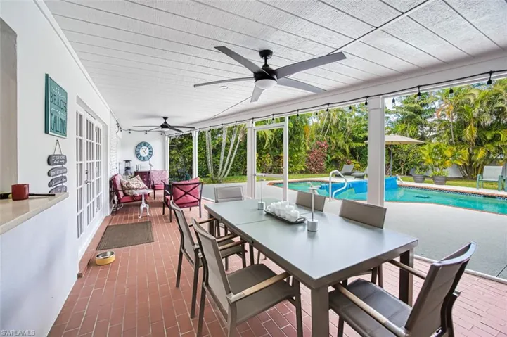 Sunroom / solarium featuring ceiling fan