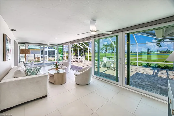 Sunroom / solarium featuring outdoor lounge area, and a patio area