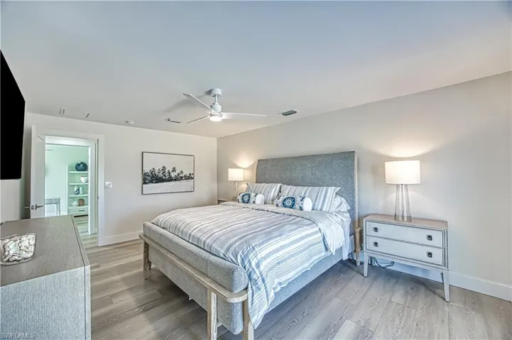 Bedroom with light wood-style flooring and ceiling fan