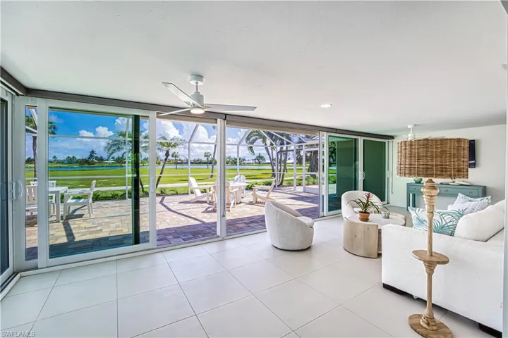 unroom / solarium featuring outdoor lounge area, and a patio area